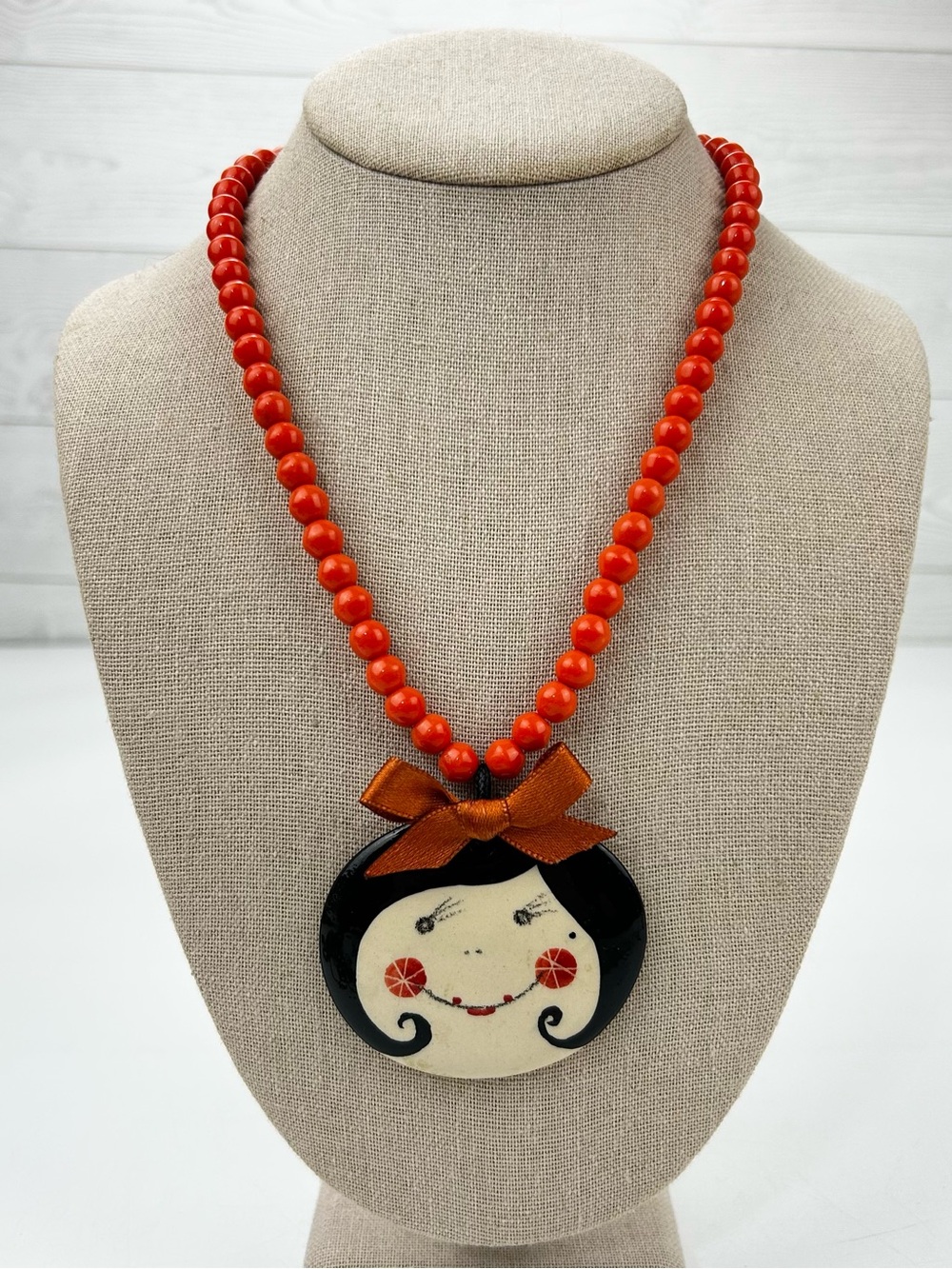 Handmade orange Beaded Necklace with Cute Face Pendant